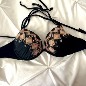 Push up bikini bathing suit tie top with silver embellishments.